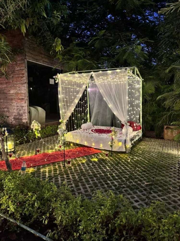 Fairy-lit canopy set for a candle-light dinner