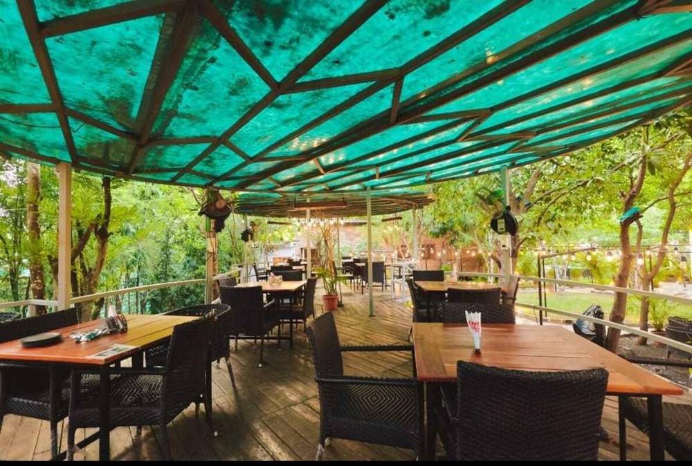Covered wooden deck with tables