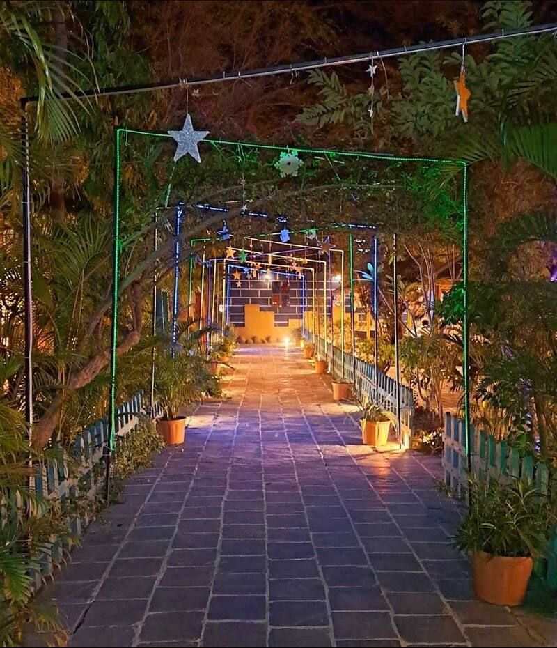 Fairy-lit walkway at 32° North East